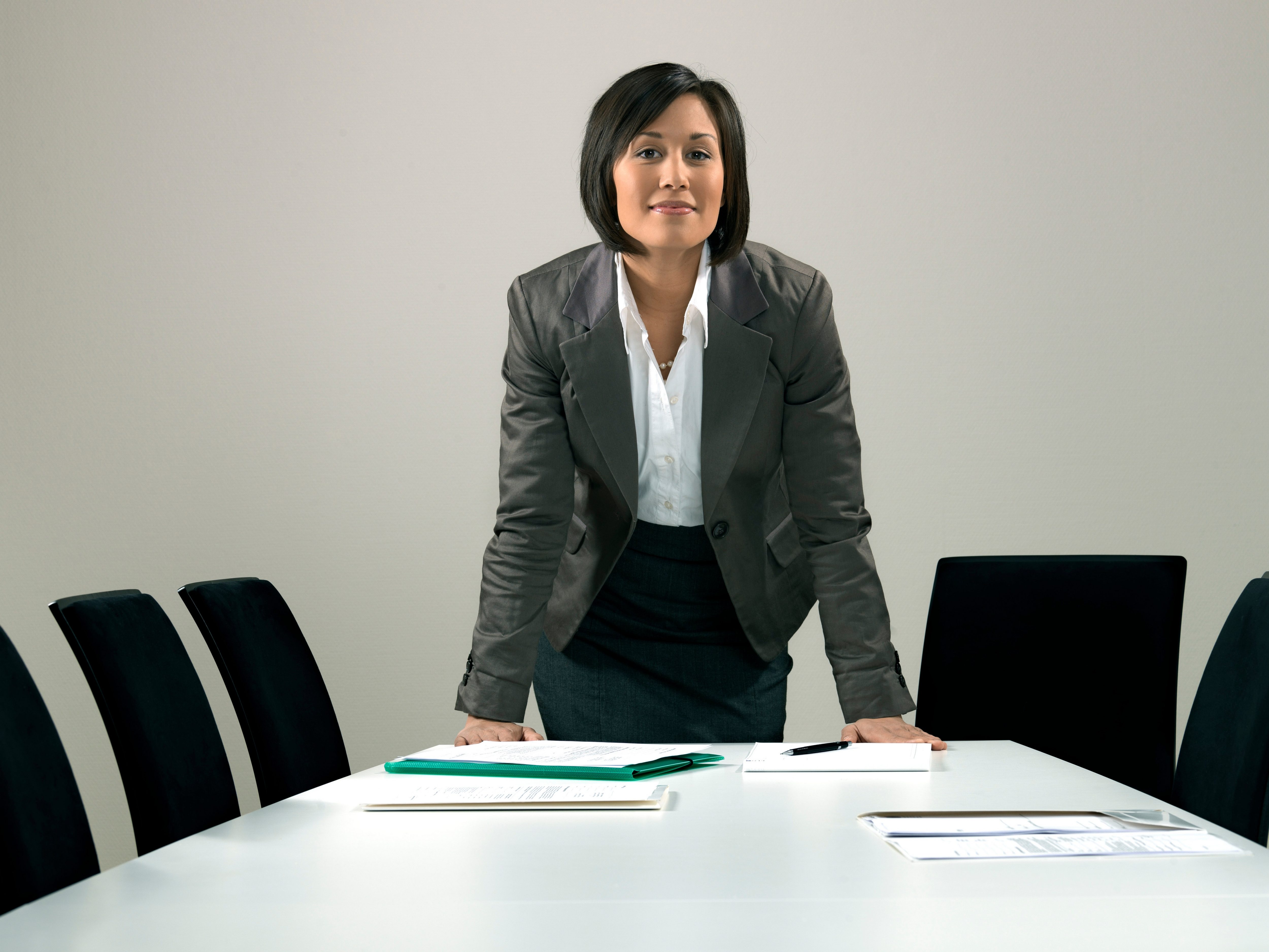 Business woman by conference table